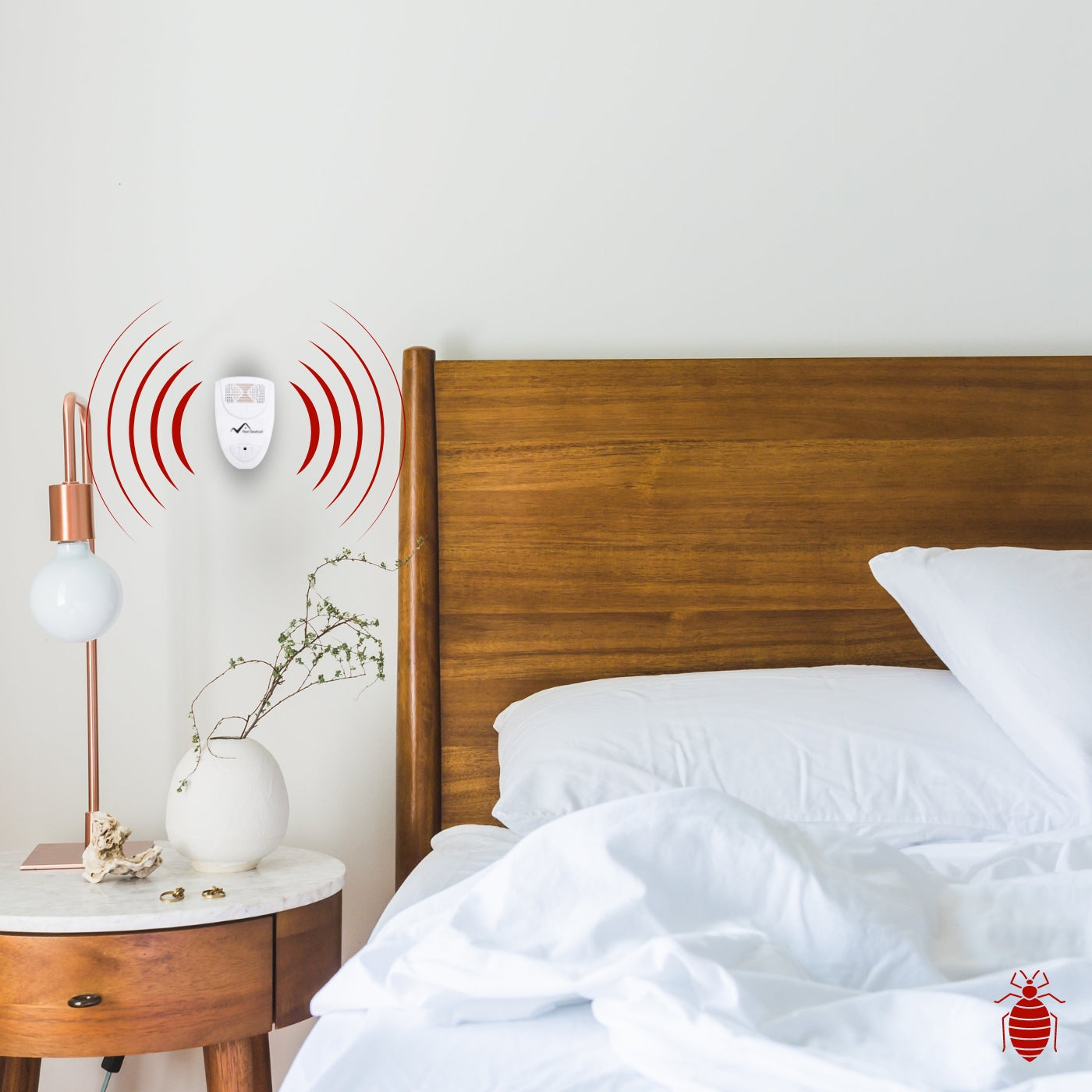 ultrasonic bedbug repeller on a bedroom wall